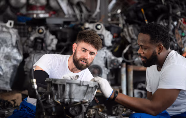 two-men-repairing-car-engine-auto-repair-shop-selective-focus_1214049-2967.avif